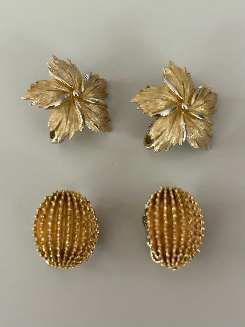 2 pairs of #CrownTrifari Clip-on Earrings. Gold-Tone Ribbed Domes and Florals.